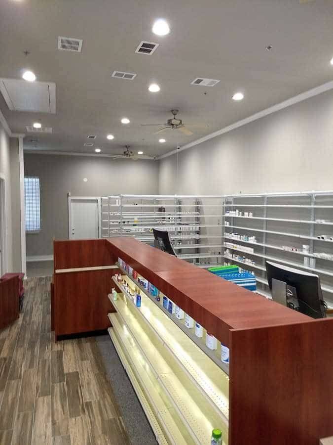 Finished pharmacy service counter and dispensing shelving in North Texas