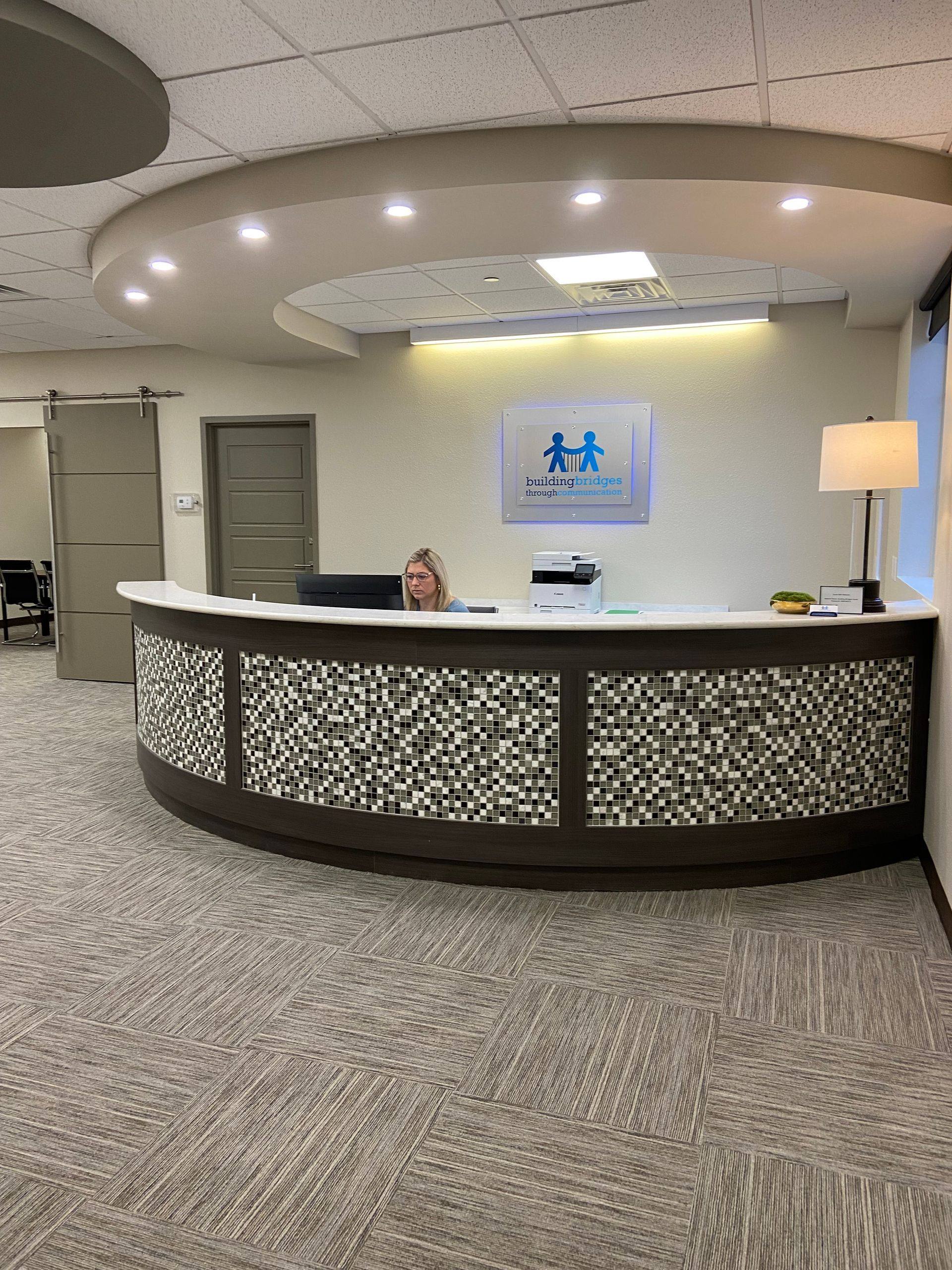After: the light, bright reception area at Building Bridges Through Communication in Frisco, TX
