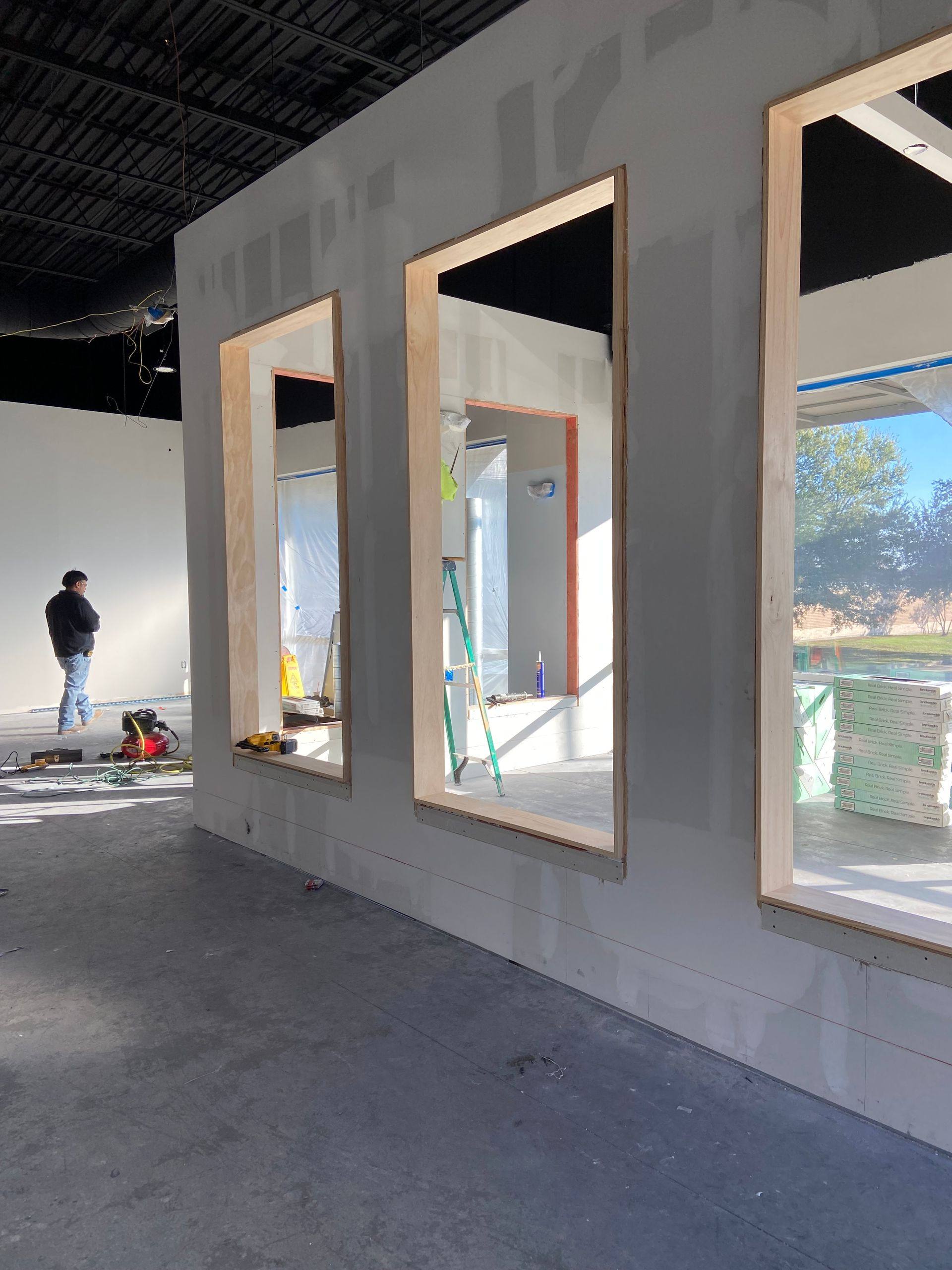 Progress: the spectator viewing windows framed out in the new wall at Kung Fu Academy of North Texas in McKinney, TX