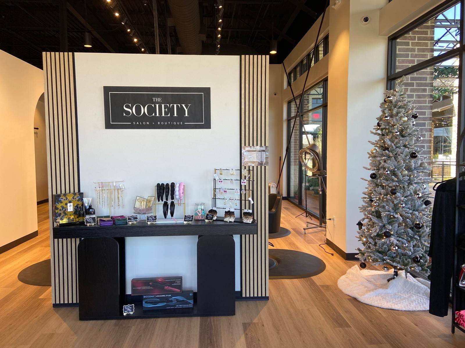 Retail display and boutique fixtures at The Society Salon in Melissa, TX