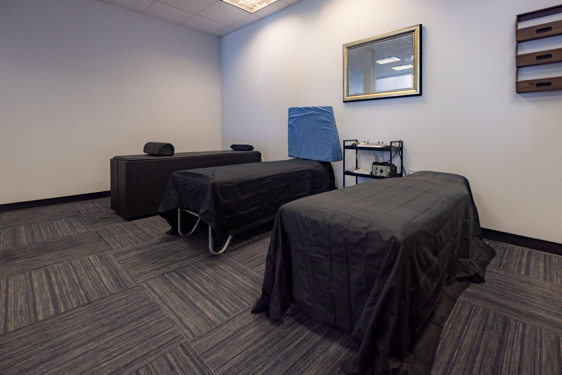 Finished treatment area with chiropractic tables at Kernetics Wellness Center in Little Elm, TX